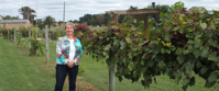 Picture of Fall in the Great Smokies woman smiling at vineyard during women's group travel tour