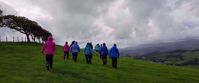 Picture of Hiking Wales women hiking green hill on cloudy day whales