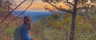 Picture of Slackpacking Georgia woman smiles for photo on fall hike in georgia