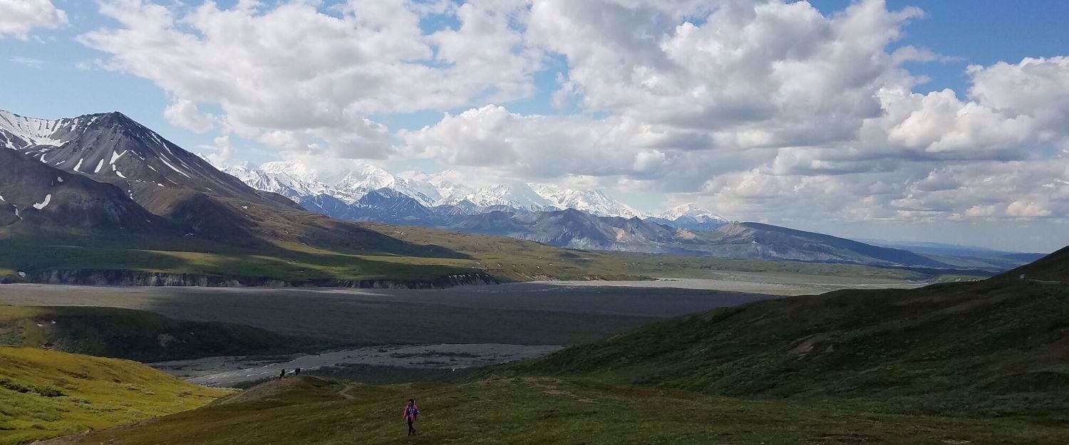 woman in far distance alaska mountains 