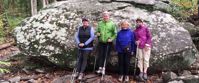 Picture of Fall in the Great Smokies women posing by boulder in the Great smoky mountains
