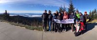 Picture of Fall in the Great Smokies women overlook great smoky mountains with Adventures in Good Company Banner