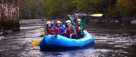 Picture of Fall in the Great Smokies Women rafting down river in great smokies triumphant paddle raise