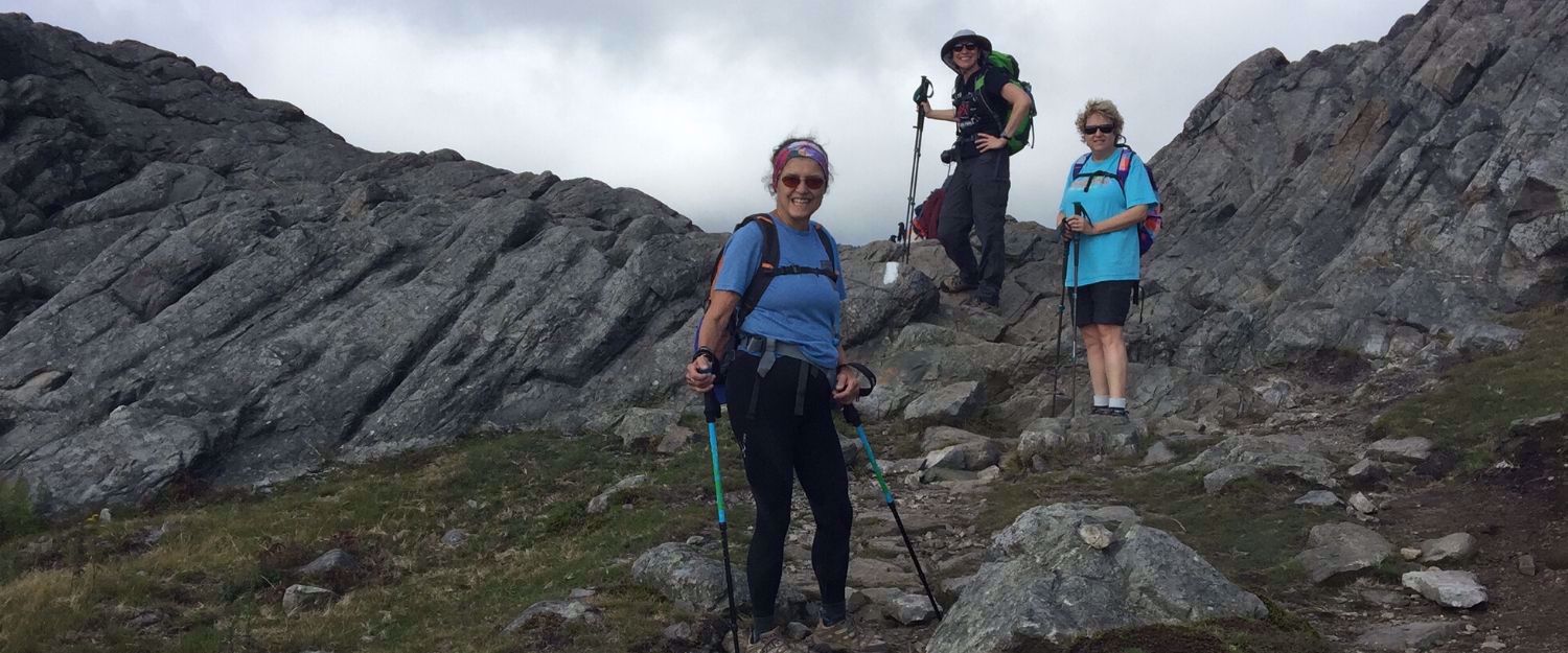 women hiking down mountains in VA